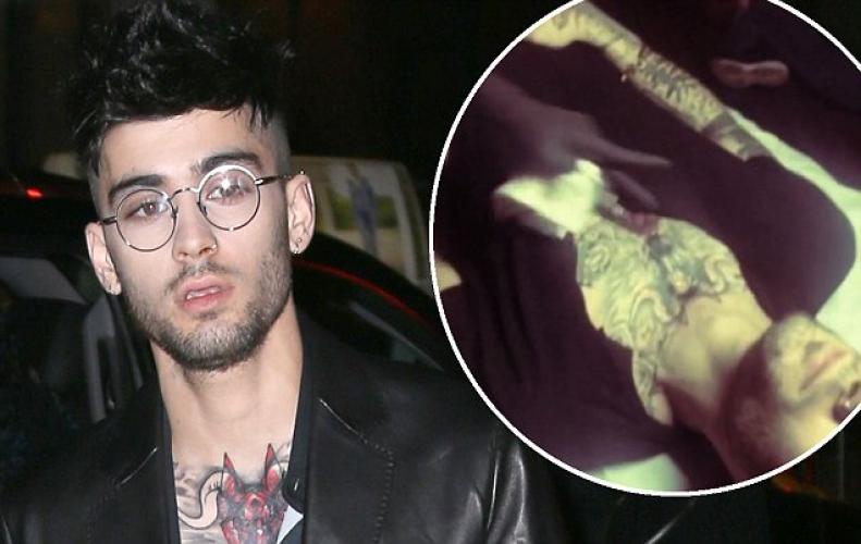 Zayn Malik tattooed red wolf on chest favoring Shah Rukh Khan amid love expression to Girlfriend Gigi Hadid. Zayn Malik tattooed red wolf on chest favoring Shah Rukh Kha...